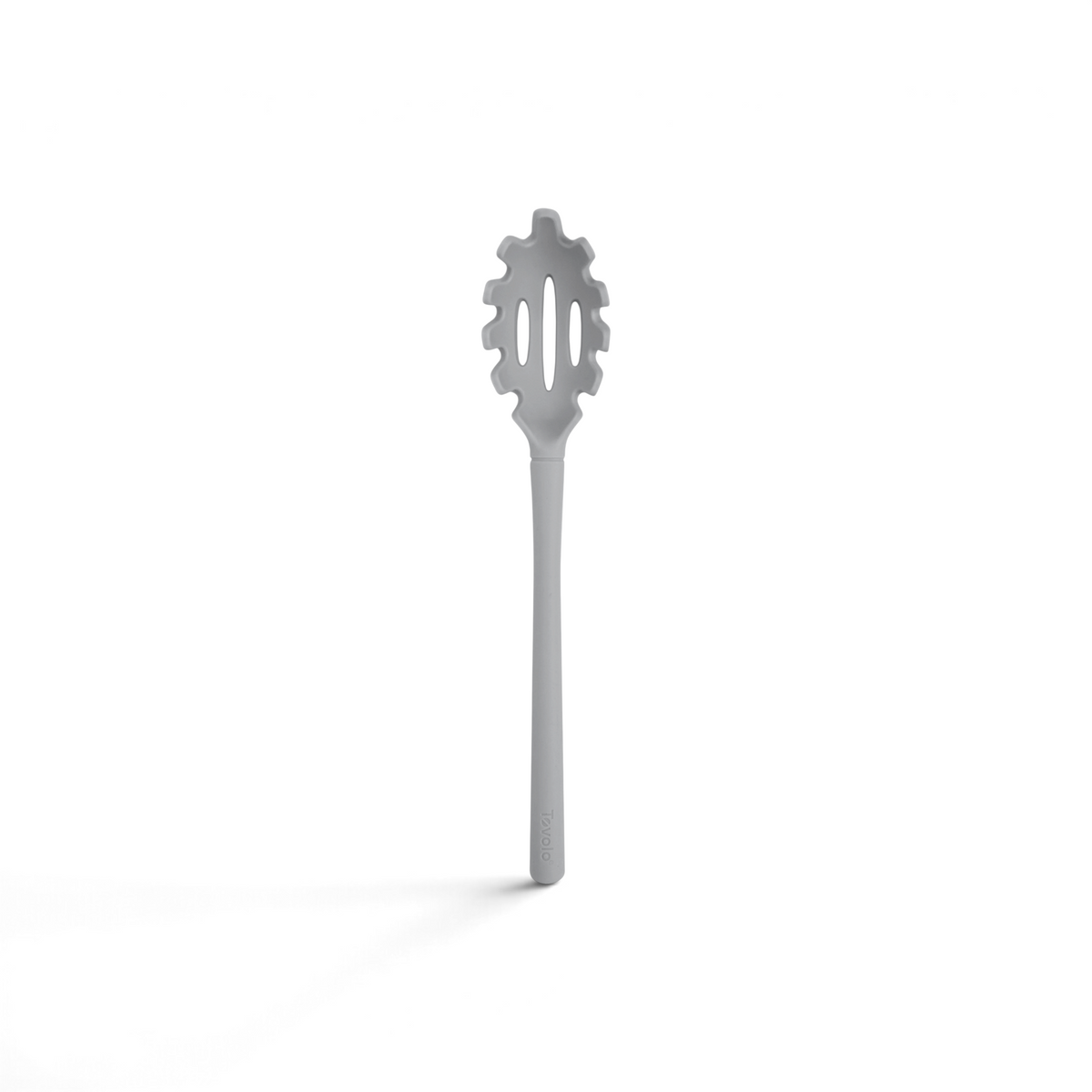 The Flex-Core Pasta Claw is a gray utensil with a long handle and a rounded, slotted head featuring prongs around the edge.