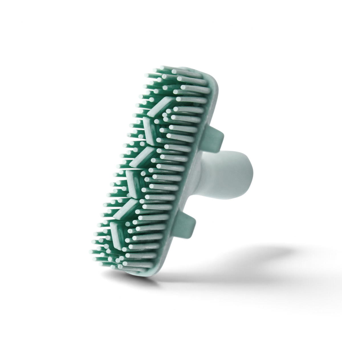 The Flex-Core Basting Brush, shown against a white background, features green and white silicone, short flexible bristles, and a handle for easy grip.