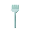 The Flex-Core Basting Brush features a light blue silicone design, long handle, and flexible bristles, displayed against a plain white background.