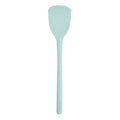The Flex-Core Scoopula is a light blue silicone spatula with a flat, broad head and a long handle, displayed against a white background.