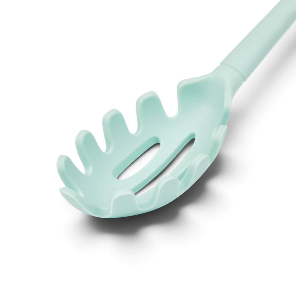 A close-up of the tovolo Flex-Core Silicone Pasta Claw, featuring pronged edges and a long handle in light blue, isolated on a white background.
