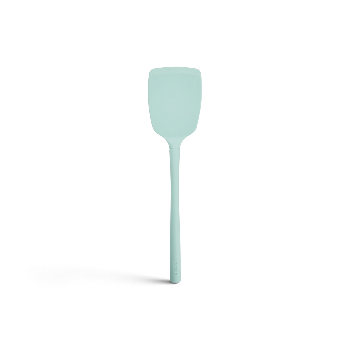 The tovolo Flex-Core Silicone Solid Turner features a light blue, rectangular, slightly curved head and a long handle, displayed against a white background.
