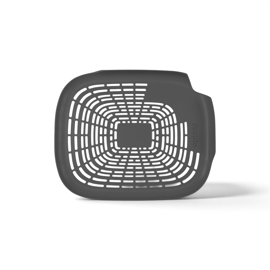 A top-down view of the Prep N Rinse Flat Colander, featuring a square, black design with rounded edges and multiple slotted holes for quick straining or rinsing vegetables efficiently.