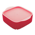 The Rinse N Store Berry Colander is a red, square container with a matching translucent lid, rounded edges, and a small side lip for easy handling—ideal as a fridge organizer for berries.