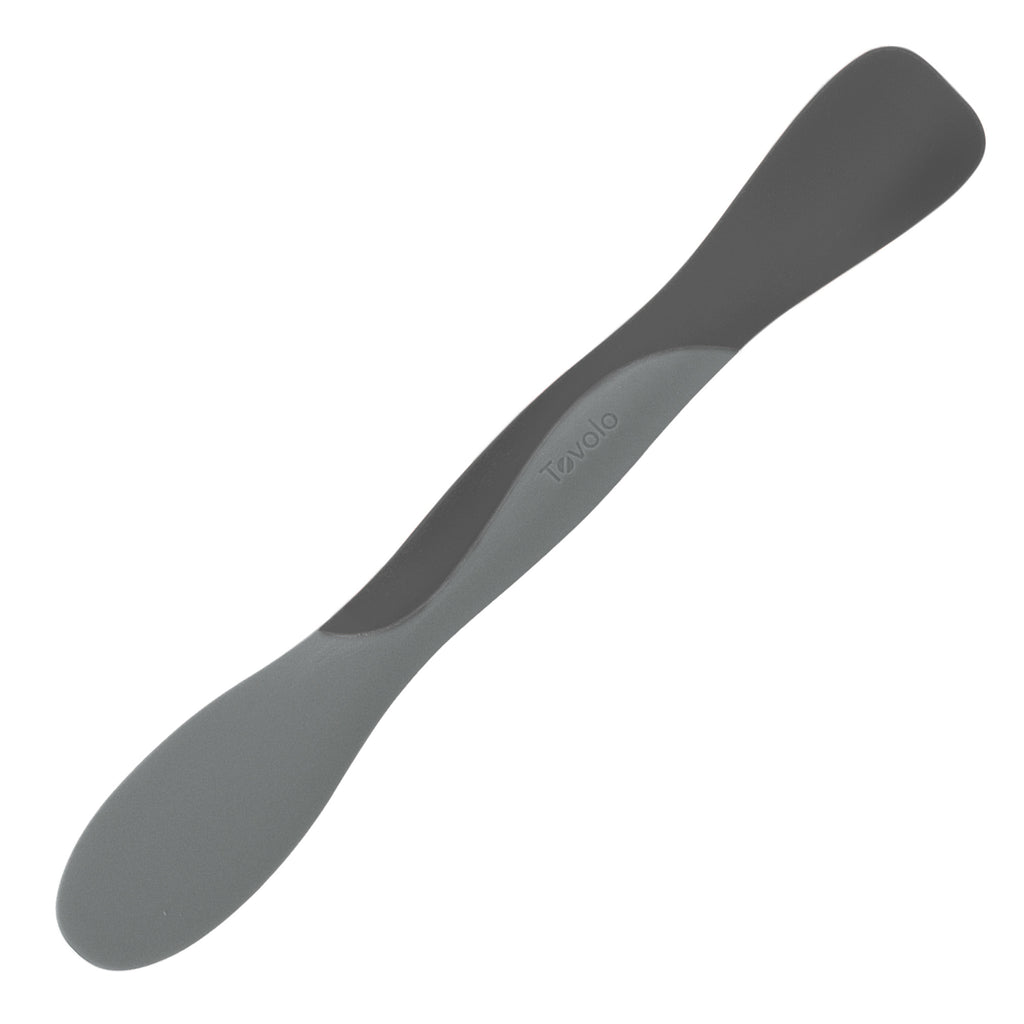 The Scoop and Spread by Tovolo is a dual-ended silicone spatula in two gray shades, featuring the brand name embossed on the handle—an essential kitchen tool for easy scooping and spreading.