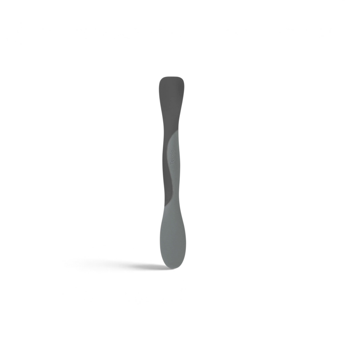 Tovolo Scoop and Spread kitchen tool in grey silicone for scraping, scooping, and spreading ingredients.