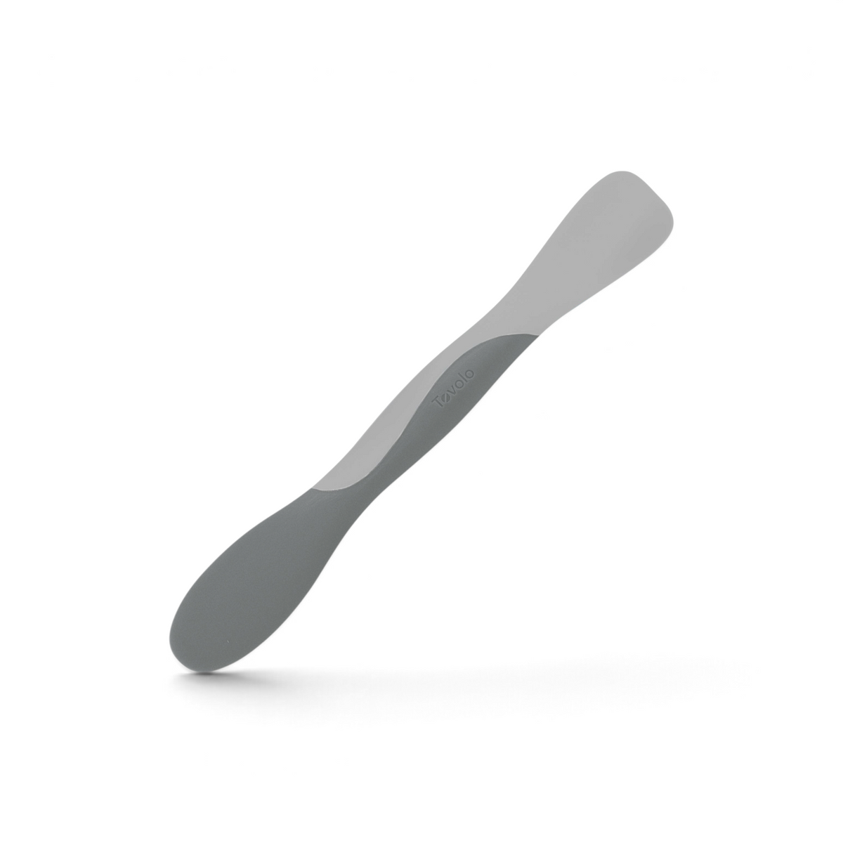 The Scoop and Spread is a double-ended gray silicone spatula with one rounded end for scooping and one flat end for spreading, making it perfect for baking. The Tovolo brand name is embossed in the center of the handle.