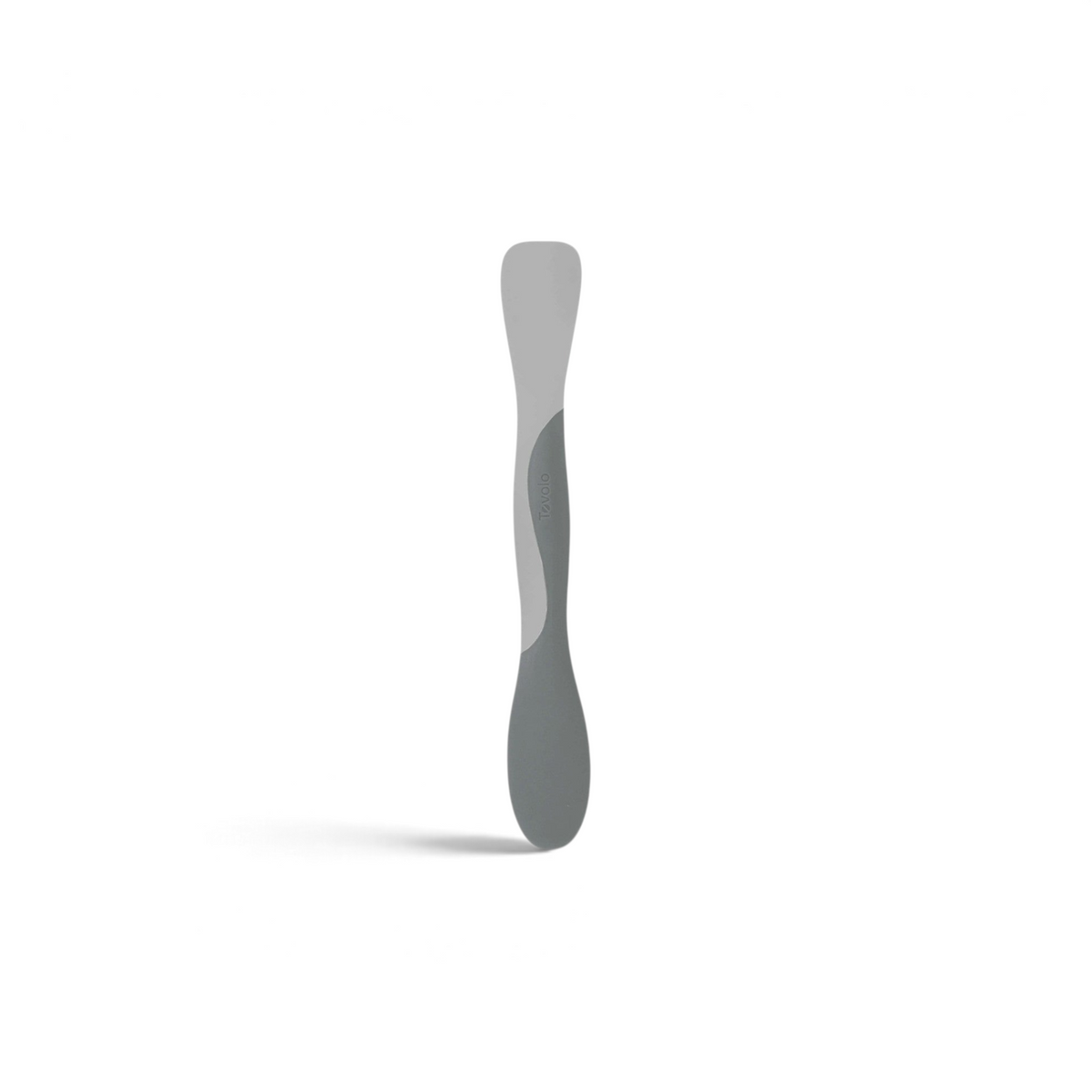 Tovolo Scoop and Spread kitchen tool in grey silicone for scraping, scooping, and spreading ingredients.