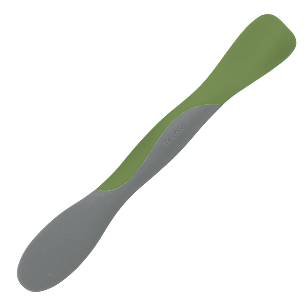 The Scoop and Spread is a dual-ended kitchen tool with gray and green silicone blades, ideal for scooping and spreading food, shown against a white background.