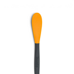 The 2-in-1 Slice and Peel Citrus Tool, featuring an orange flexible head and black handle with the Tovolo brand name, is displayed against a white background—a handy addition to your kitchen.