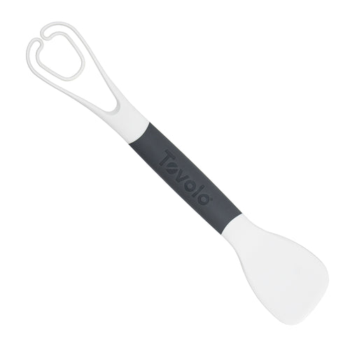 The Tovolo 3-in-1 Egg Tool is a white and gray kitchen utensil with a spatula on one end, tongs on the other, and the Tovolo brand name on the handle.