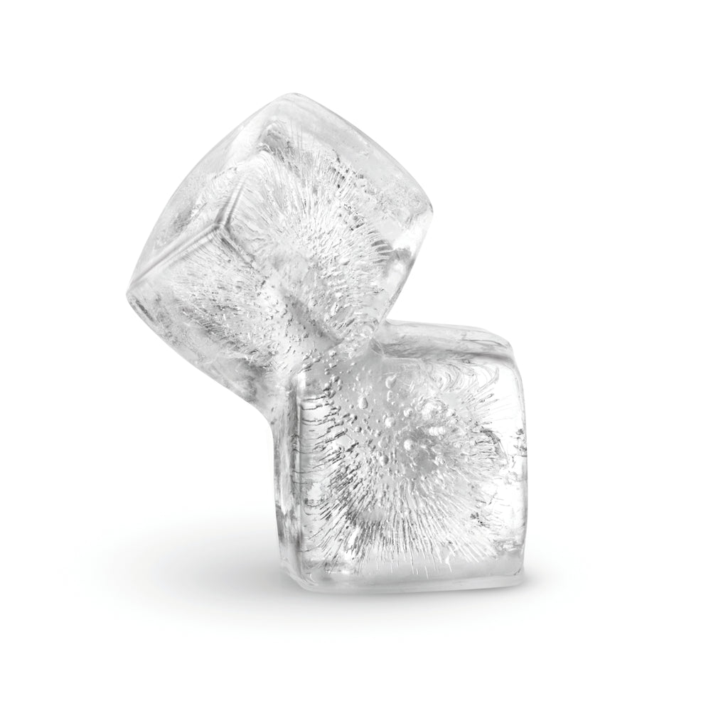 Two crystal-clear, slow-melting ice cubes—made with Ice Molds—are stacked at an angle against a white background, with visible air bubbles inside.