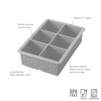 The tovolo King Cube Silicone Ice Mold features sturdy silicone construction, long-lasting color, and a beveled bottom for easy 2-inch cube removal. BPA free, food safe, and dishwasher safe icons included. Six compartments.