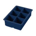 The King Cube Ice Mold is a dark blue silicone tray with six large rectangular compartments, ideal for crafting oversized ice cubes.