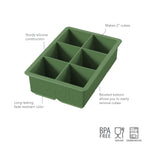The tovolo King Cube Silicone Ice Mold features six 2-inch sections for large ice, a sturdy green silicone build, beveled bottoms for easy release, and is BPA free, food safe, and dishwasher safe—your ultimate craft ice tray.