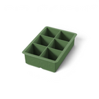The tovolo King Cube Silicone Ice Mold is a green tray with six large square compartments, ideal for making big ice cubes. The brand name 'tovolo' is embossed on the side and visible from an angle.