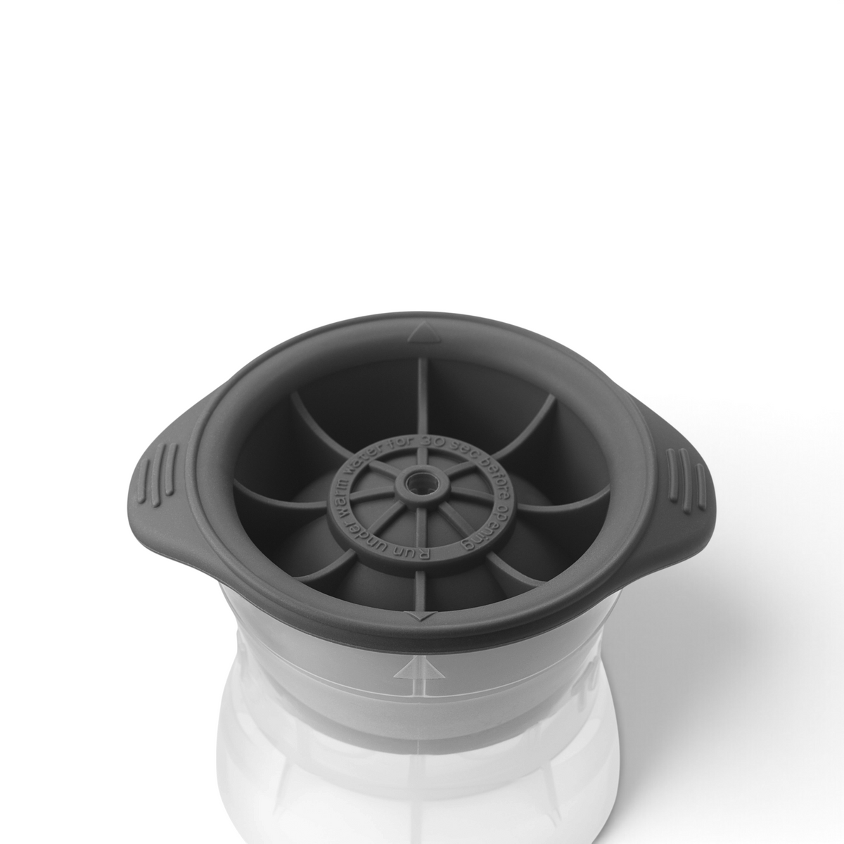 A top-down view of Tovolo's Baseball Ice Molds (Set of 2), gray and round with six inner sections and two handles, shown on a transparent container. The stackable molds are ideal for making baseball-shaped ice for food or drinks.