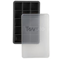 The tovolo Perfect Cube Silicone Ice Mold, shown in black with ten rectangular compartments, is displayed beside a translucent plastic lid marked with the tovolo logo.