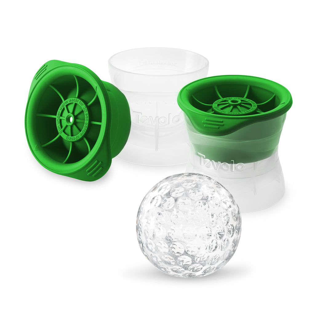 Two green and clear stackable Sports Ice Molds, ideal for making Baseball Craft Ice, are shown with one clear, textured ice sphere in front of them on a white background.