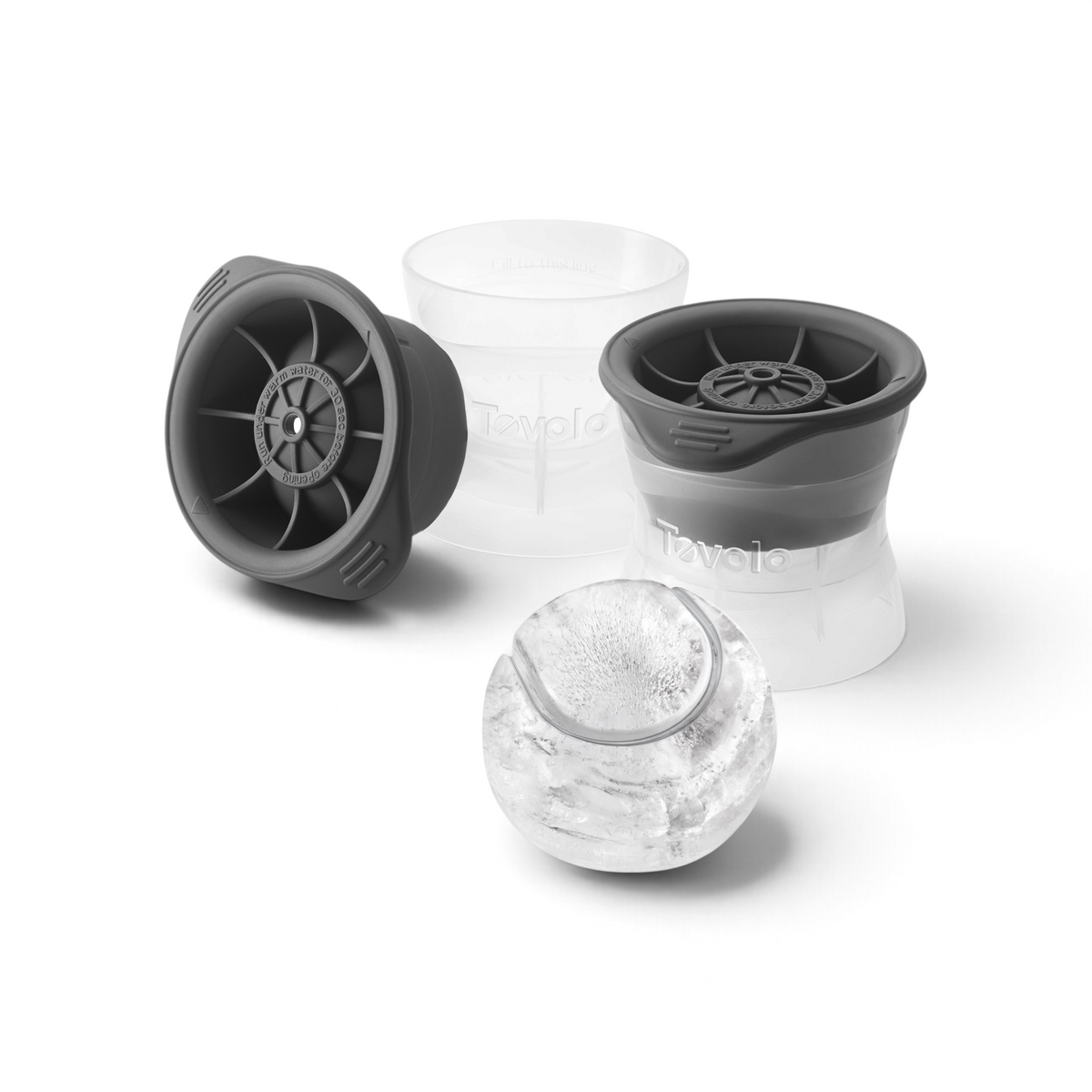 The tovolo Baseball Ice Molds set includes two stackable molds—one filled with water, the other displaying a finished round ice sphere—perfect for crafting large, baseball-shaped ice cubes.