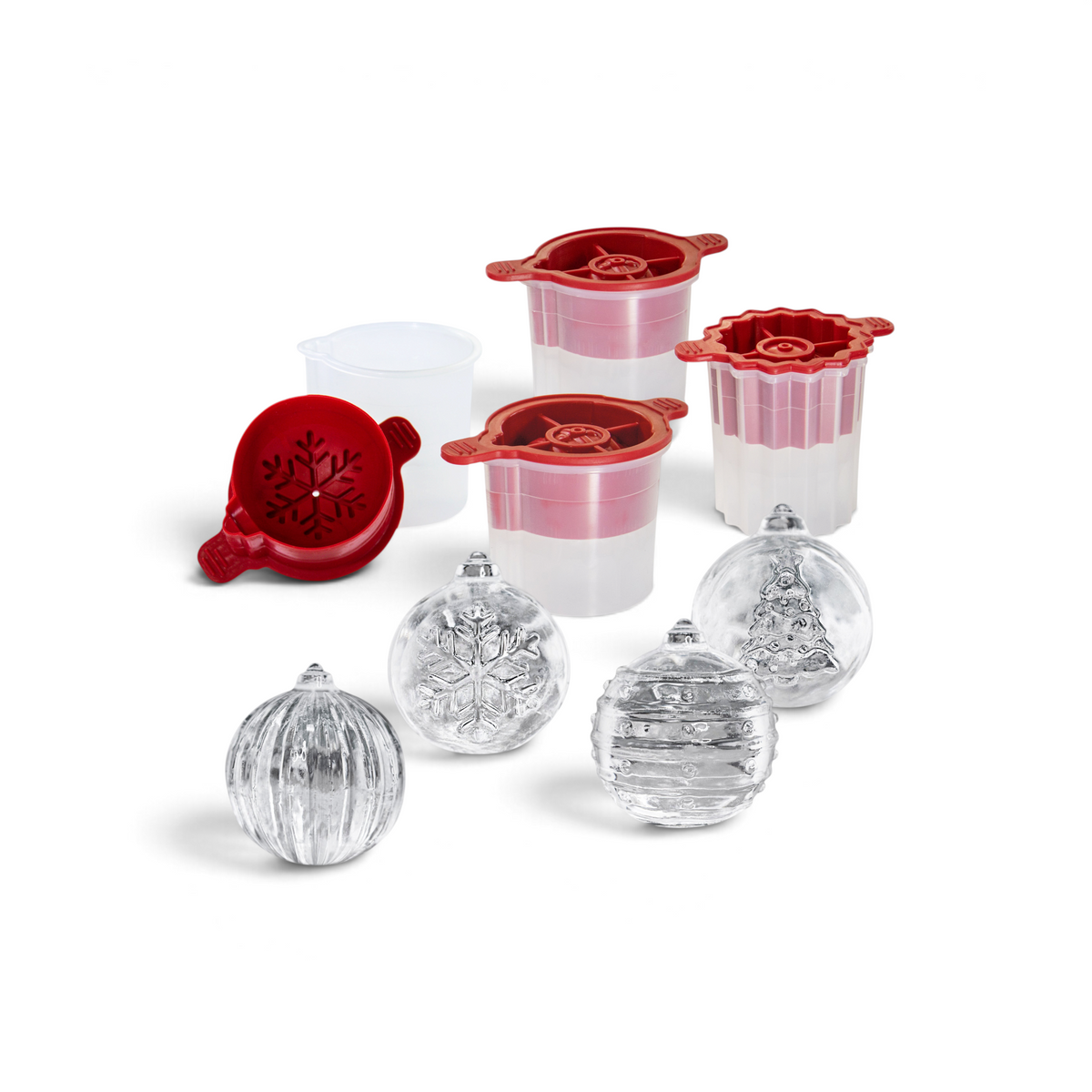 The tovolo Holiday Ice Molds set includes four clear molds with red lids and a white measuring cup, creating festive snowflake, Christmas tree, striped, and ridged ice balls—perfect for holiday cocktails or as a unique Christmas gift.