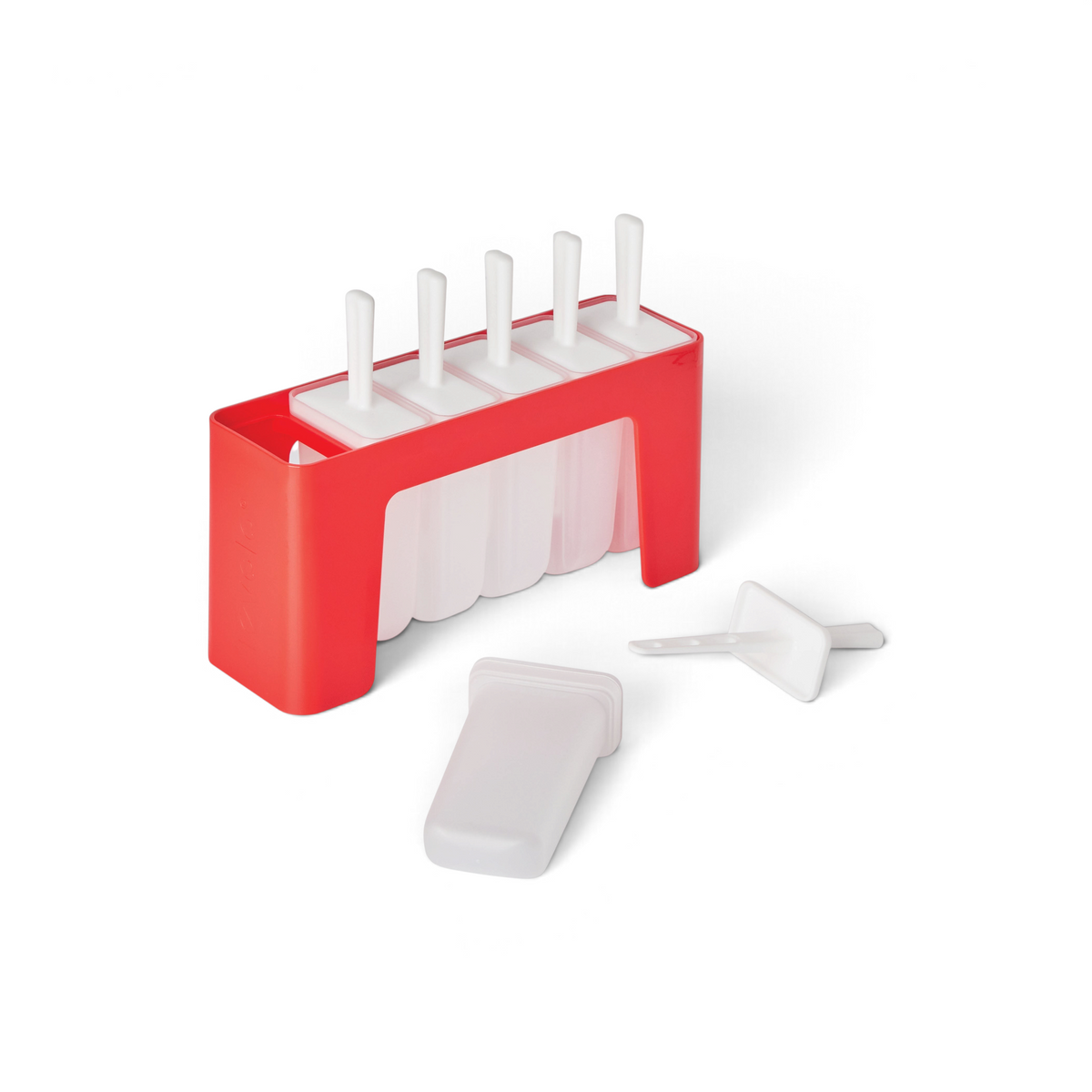 The Pop Molds w/ Tray is a red and white plastic popsicle mold featuring five slots, each with a white handle and a slimline tray. One homemade frozen treat is removed and displayed in front of the tray.