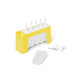 The Pop Molds w/ Tray is a yellow and white slimline popsicle mold with five slots—four filled with white sticks for homemade treats, one slot open. A popsicle stick and lid lie in front of the mold.