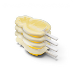 Four yellow popsicles made with the tovolo Stackable Pop Molds are stacked together. Each has a white stick and a frosted, translucent look that showcases their playful, stackable design.