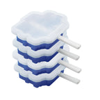 Four Stackable Pop Molds in blue and white with white handles, shown stacked side-by-side against a white background.