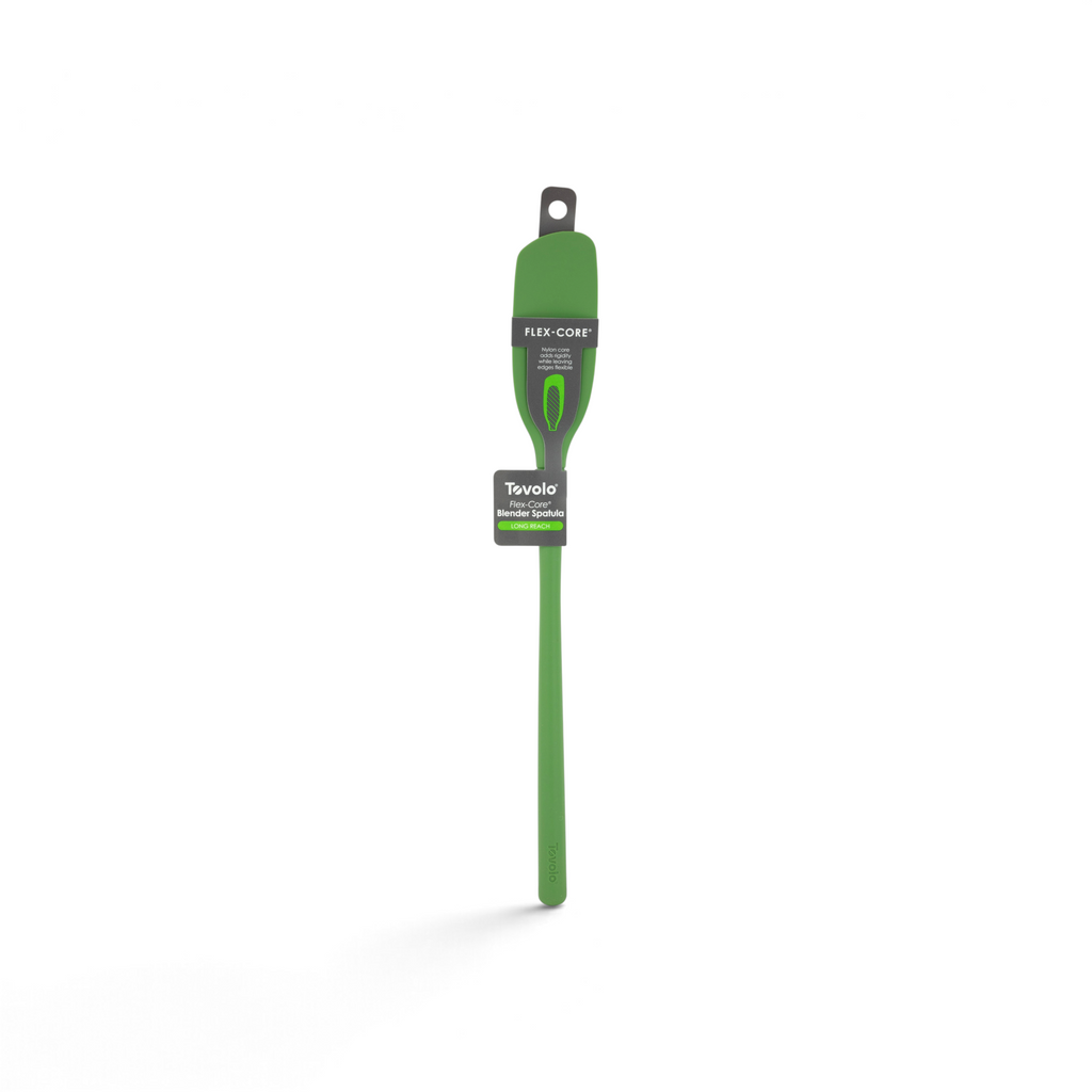 A green silicone Flex-Core Blender Spatula with packaging labels attached, designed for mixing and scraping in the kitchen.