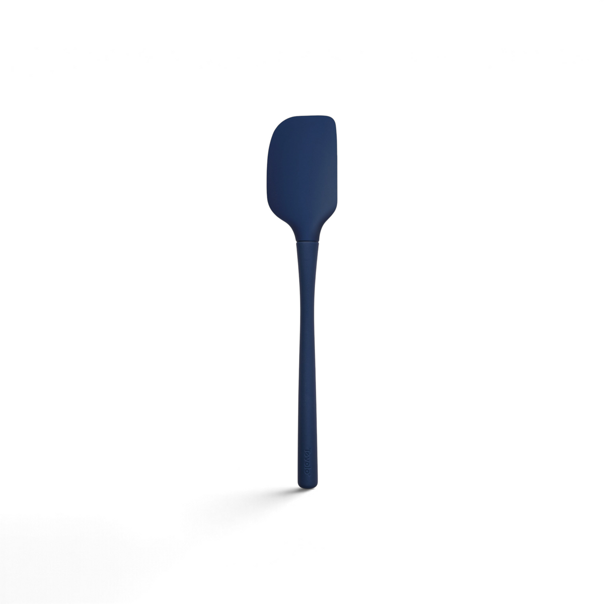 The Flex-Core Spatula features a dark blue color, a long handle, and a rectangular, slightly curved blade, displayed against a white background.