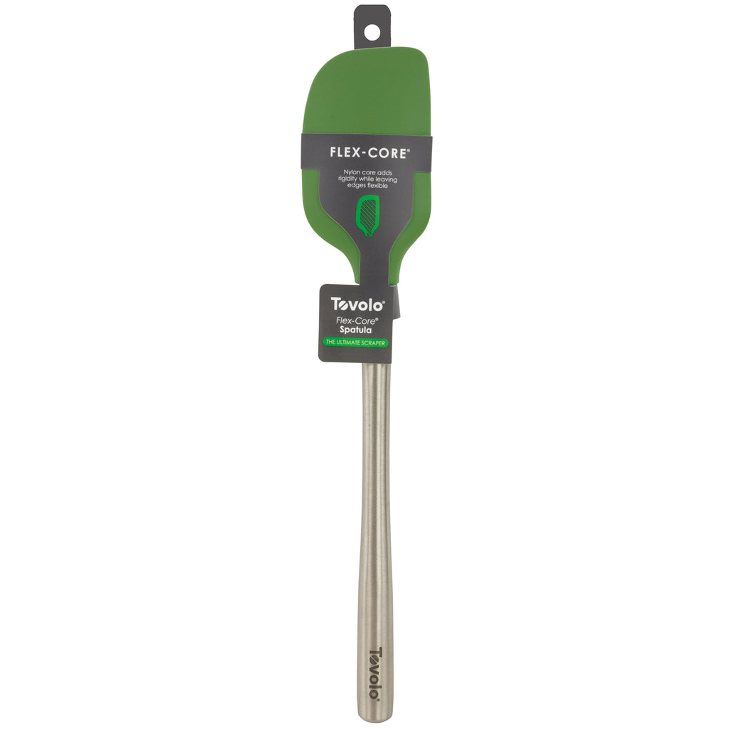 The Tevolo Flex-Core Spatula, shown in green silicone with a stainless steel handle, features Flex-Core® technology for flexibility and durability. Packaged with a label noting it's dishwasher safe for easy cleaning.