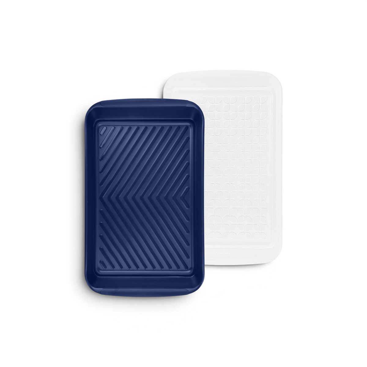 The Marinade Tray set includes two reusable rectangular trays: one solid navy with a chevron pattern, and one semi-transparent white with a circular textured design—ideal for marinating or grilling.