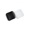 The Prep and Serve BBQ Tray, featuring a black chevron-patterned square tray and a clear plastic lid with a textured grid design, is displayed on a white background—perfect for grill masters aiming to prevent contamination.