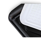 Three Prep and Serve BBQ Trays are stacked diagonally: two black with smooth surfaces underneath, and a white one with a textured geometric leaf pattern on top—ideal for grill masters to prevent contamination while serving.