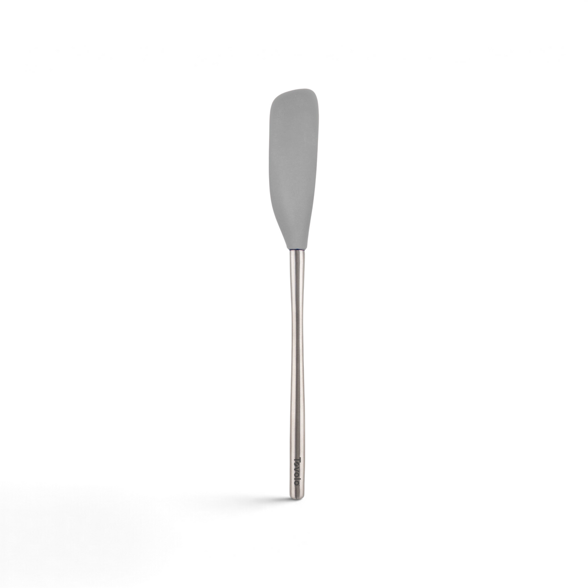The tovolo Flex-Core Silicone Jar Scraper features a grey silicone head and a slim stainless steel handle, making it ideal for scraping jars. Shown here against a plain white background.