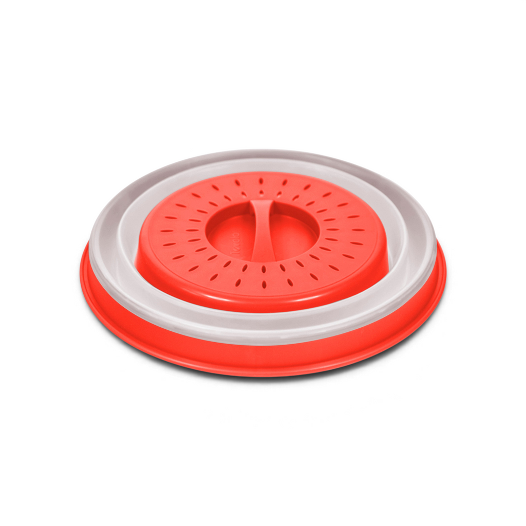 The Collapsible Microwave Food Cover, made of high heat-resistant plastic in red and white, features a central handle and vent holes to prevent splatters during heating.