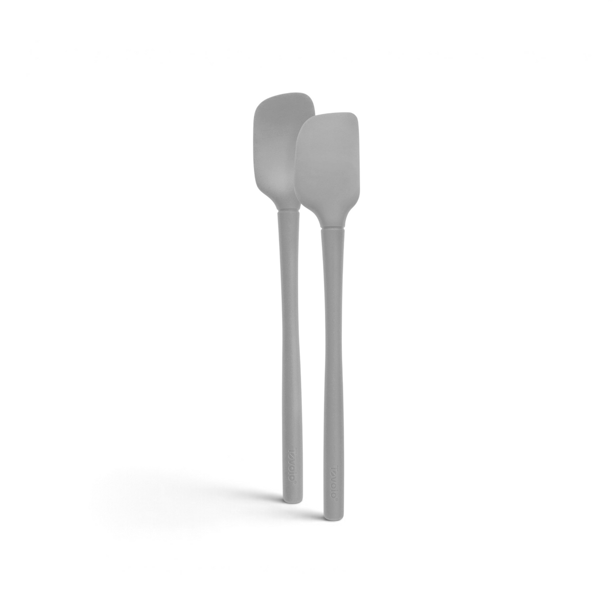 The tovolo Flex-Core Silicone Mini Spatula + Spoonula features two gray, heat-resistant utensils with long handles, shown side by side against a white background.