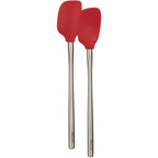 The Flex-Core Mini Spat + Spoonula, two red heat-resistant kitchen tools with long stainless steel handles, stand side by side on a white background.