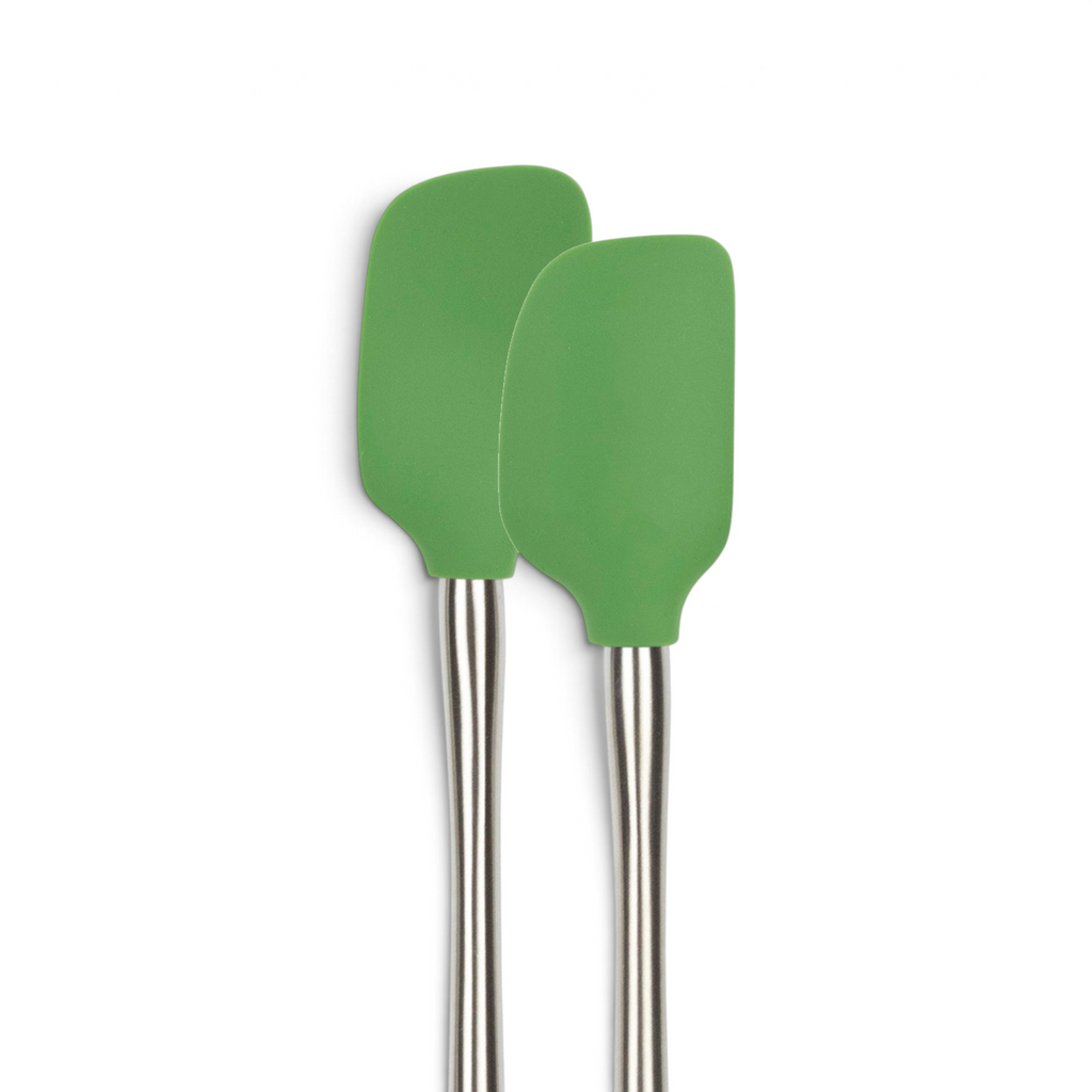 The tovolo Flex-Core Silicone Mini Spatula and Spoonula, both green with stainless steel handles, stand upright side by side against a plain white background.