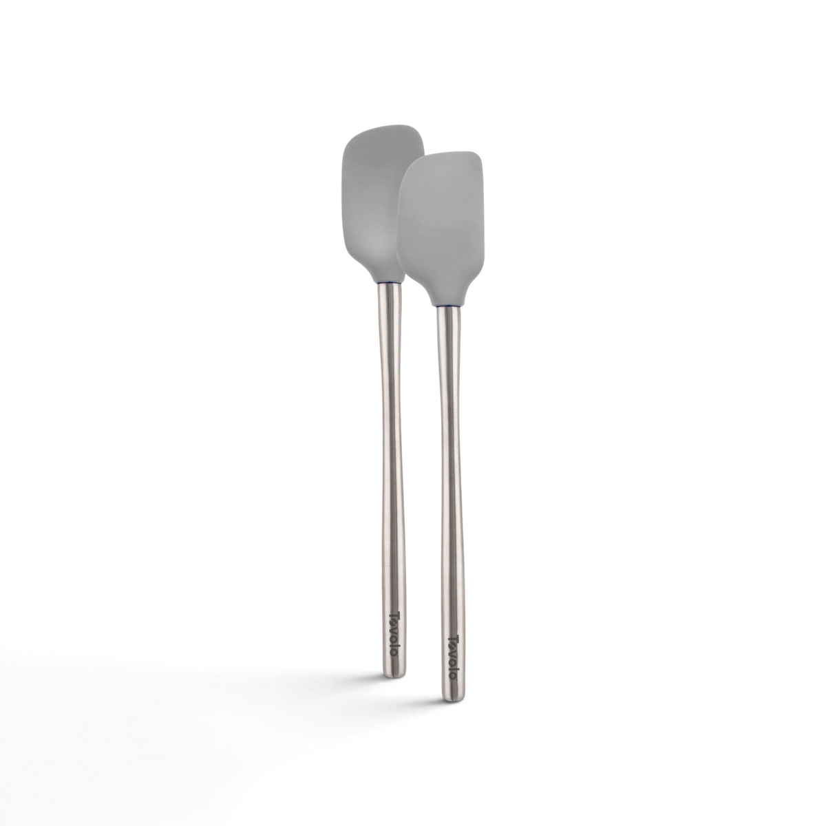 The tovolo Flex-Core Silicone Mini Spatula and Spoonula, both in gray with long stainless steel handles, are displayed side by side on a white background.