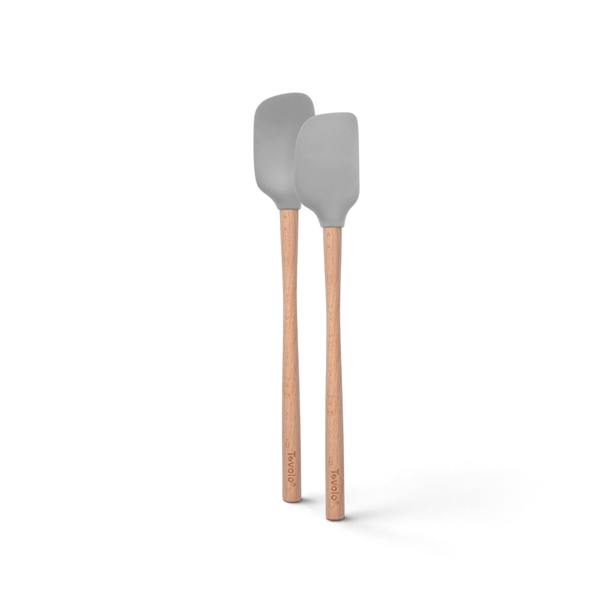 Two tovolo Flex-Core Silicone Mini Spatula and Spoonula, both with gray silicone heads and wooden handles, stand upright side by side on a white background.