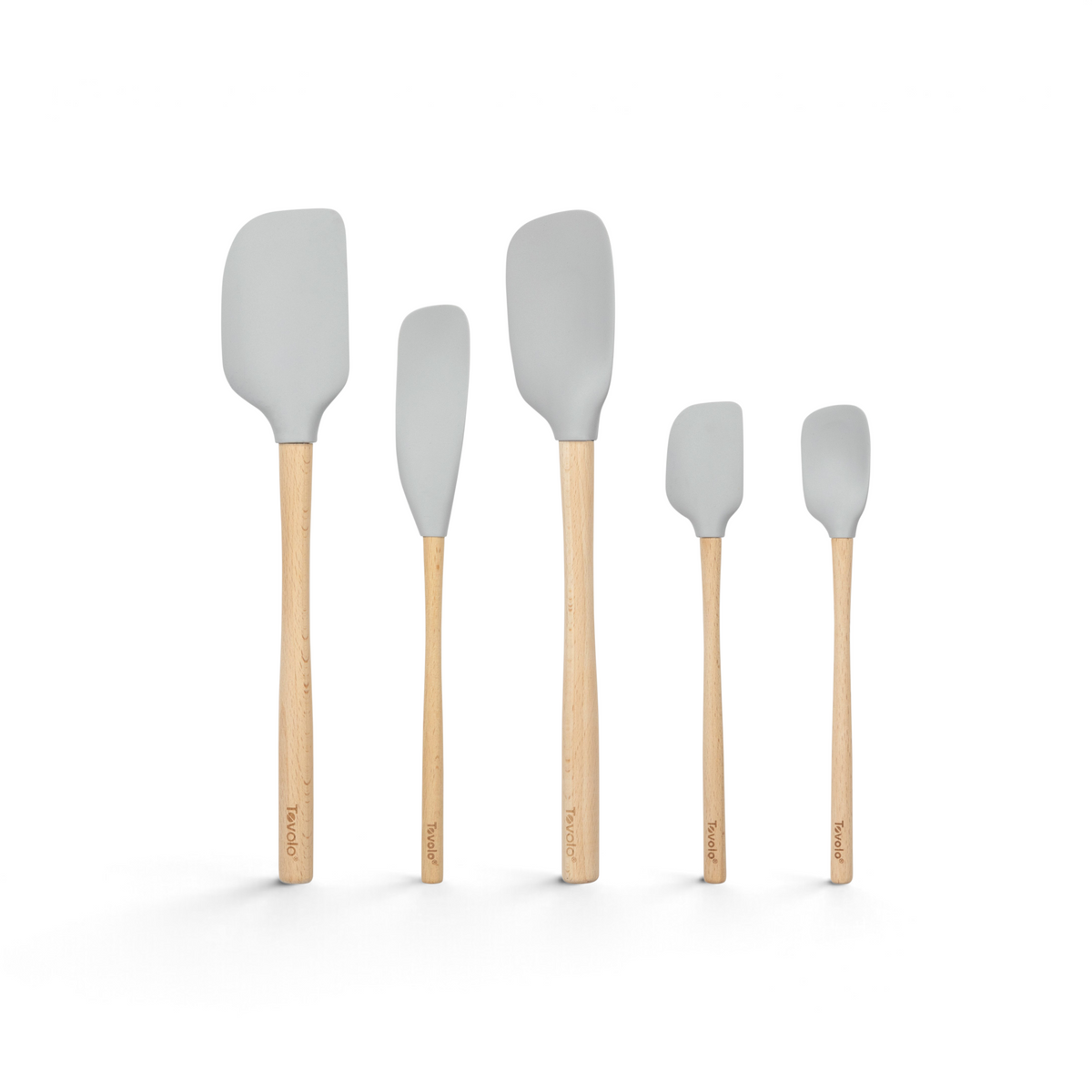 The Flex-Core Wood-Handle Spatula Set of 5 features gray silicone spatulas, including a Classic Spatula and Jar Scraper, each with labeled Tovolo wooden handles, arranged upright in a row against a white background.