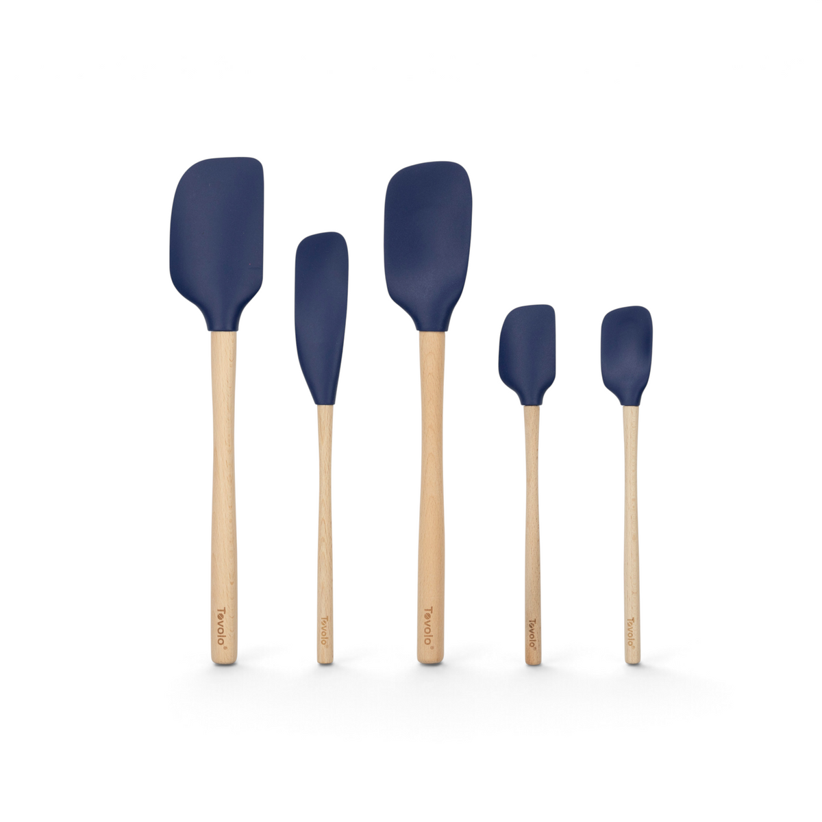 The Flex-Core Wood-Handle Spatula Set of 5 features dark blue silicone heads and wooden handles, including a classic spatula and jar scraper, all arranged from largest to smallest on a white background—ideal for any kitchen.