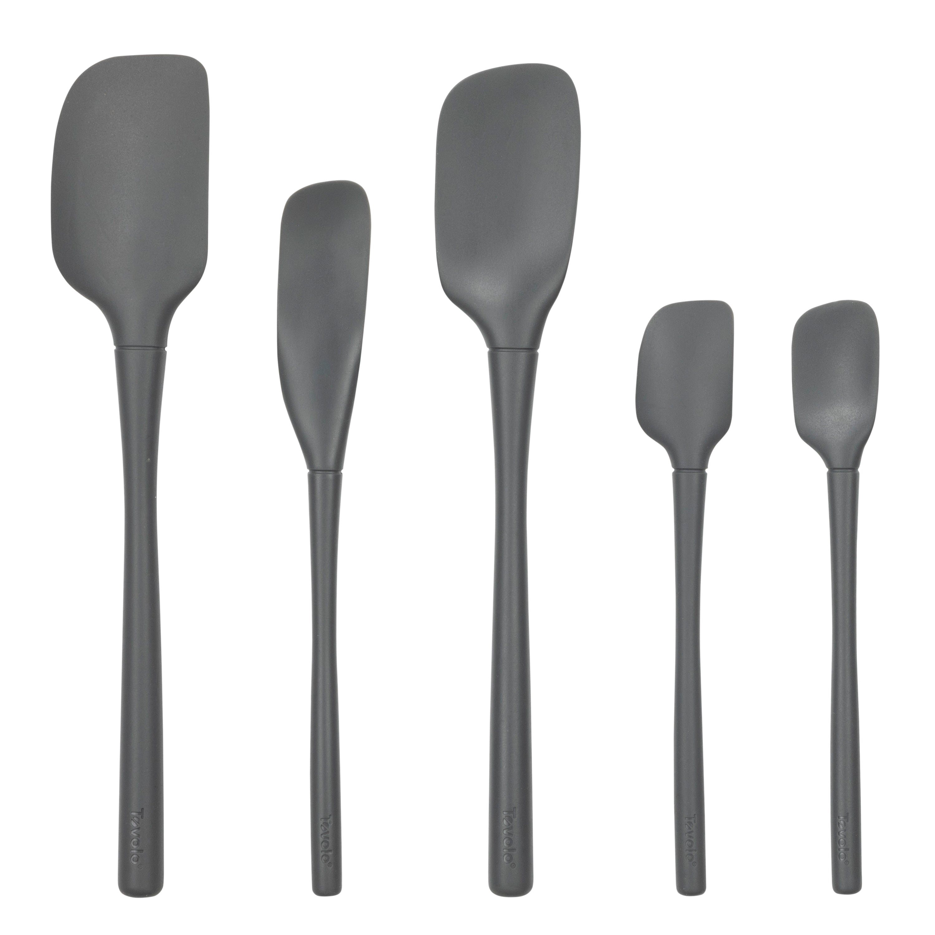 Five black tovolo Flex-Core All-Silicone Spatula Set of 5 pieces, including a classic spatula and jar scraper, stand upright in a row against a white background for versatile kitchen use.