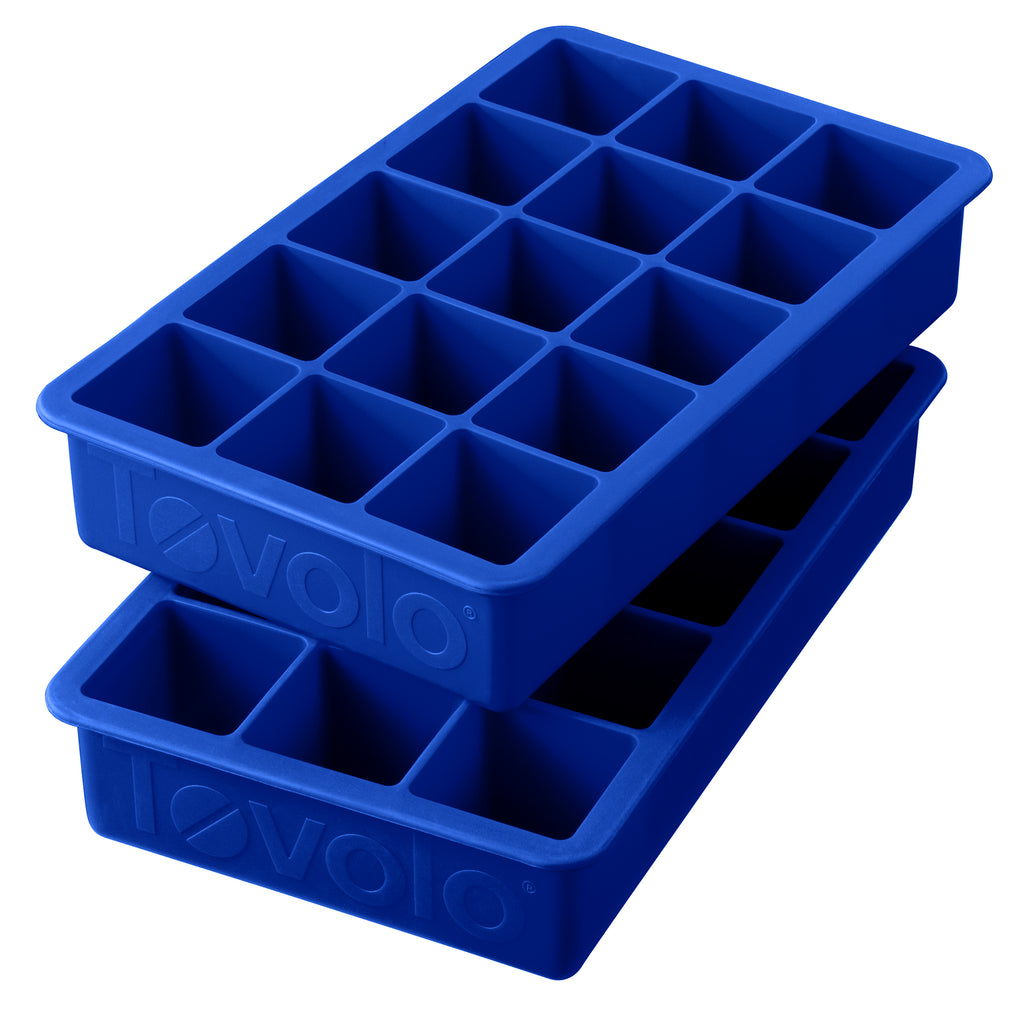 Two blue Perfect Cube Ice Molds, each with 15 square compartments, stacked together. These silicone trays are durable for long-lasting ice and feature the brand name embossed on the sides.