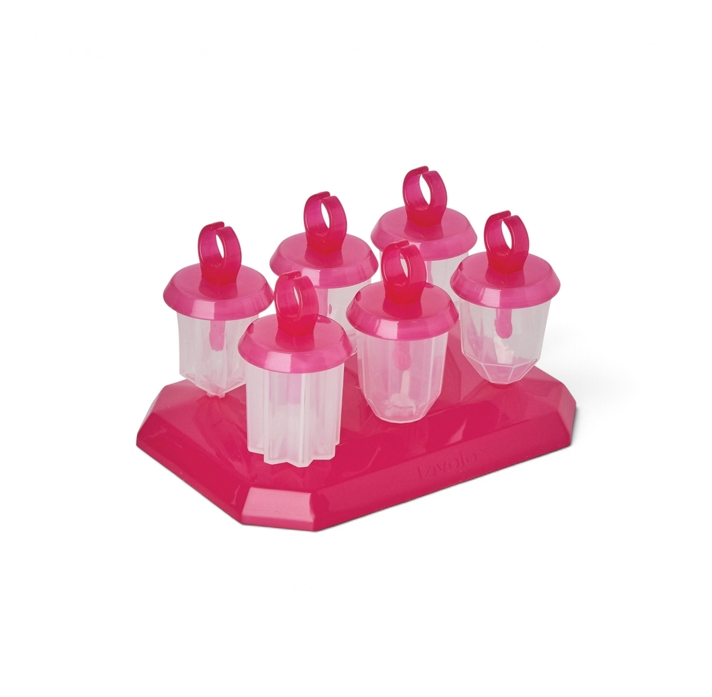 The Jewel Pop Molds set includes six pink and clear plastic popsicle molds with round handles, neatly arranged on a matching slim tray—ideal for creating homemade frozen treats.