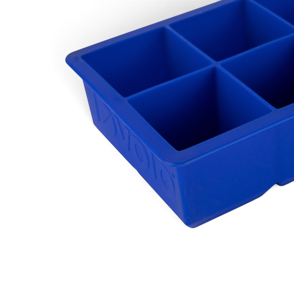 A close-up of the tovolo King Cube Silicone Ice Mold, featuring six large square compartments, is shown from an angle—perfect for making oversized ice cubes.