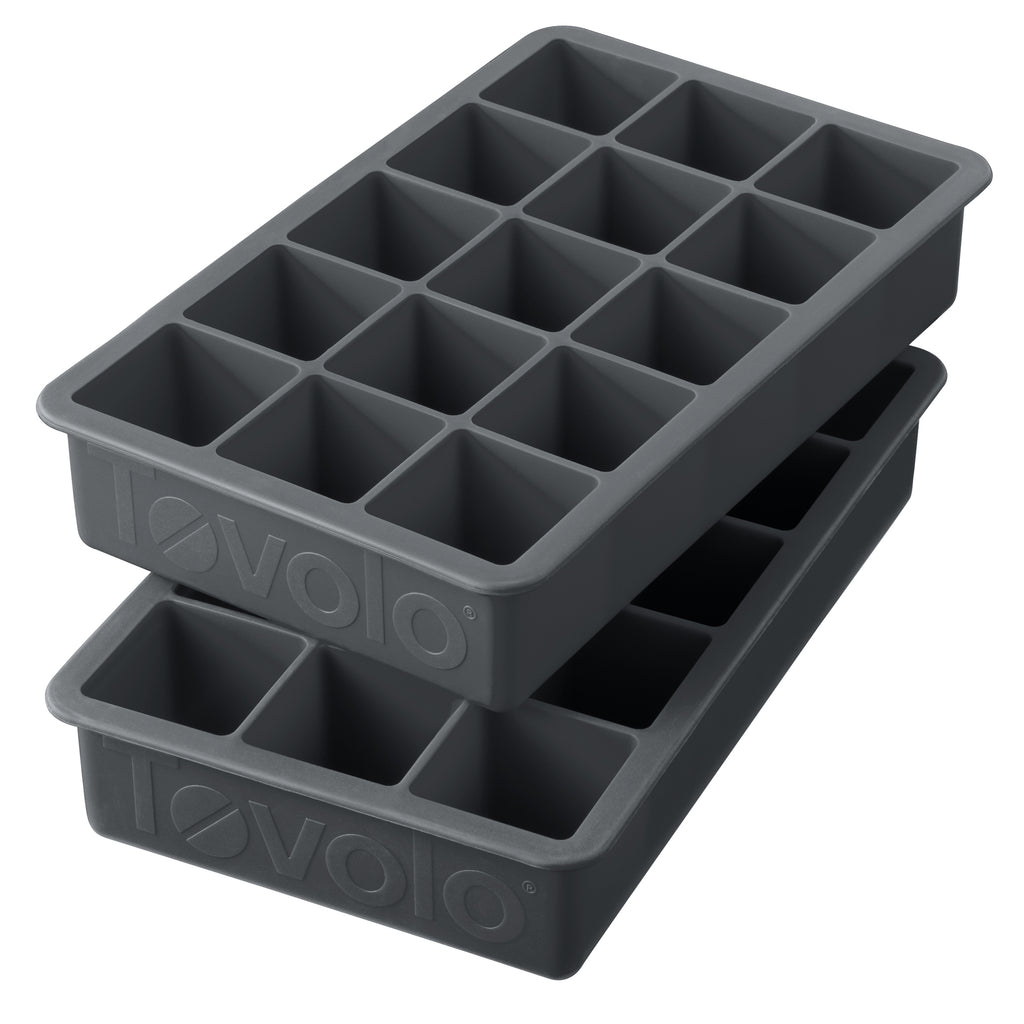 The tovolo Perfect Cube Silicone Ice Molds (Set of 2) are black, food-grade trays, each with fifteen square compartments for making long-lasting ice cubes.