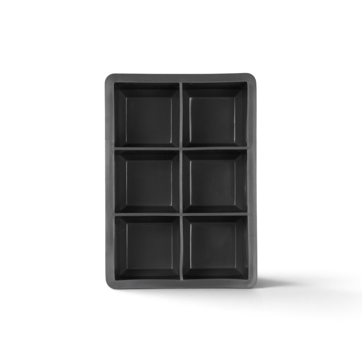 The tovolo King Cube Silicone Ice Mold, shown from above on a white background, features six square cavities in a black tray—perfect for making large ice cubes.